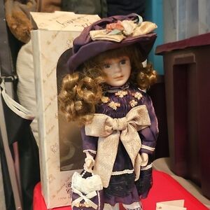 Charming Purple Doll with Gold Details